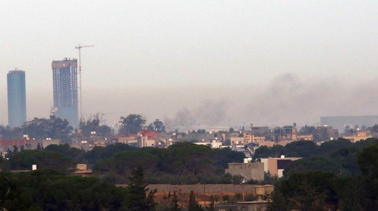 Smoke billows on November 25, 2014 from the Mitiga airport in an eastern suburb of the Libyan capital Tripoli held by anti-government militias, after an airstrike by forces loyal to Libya's internationally recognized government. Mahmud Turkia/AFP