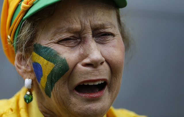 This fan who broke down at the Fan Fest public viewing event in Sao Paulo. Photo by Miguel Schincariol/AFP