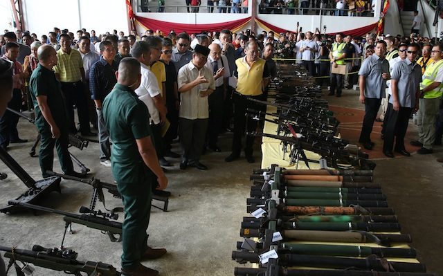 TURNOVER OF WEAPONS. President Benigno Aquino III observes the turnover of weapons and the decommissioning of combatants of the Bangsamoro Islamic Armed Forces of the Moro Islamic Liberation Front in Sultan Kudarat, Maguindanao, on June 16, 2015. Photo by Ryan Lim/ Malacañang Photo Bureau 
