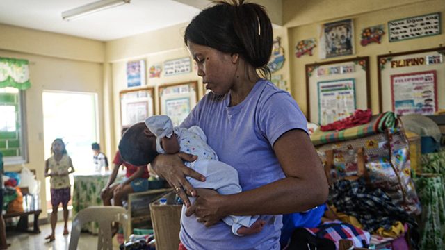 MOTHER. Elizabeth, a factory worker, takes care of her one-month old baby in an evacuation center in the town of Mataasnakahoy in Batangas. She and her family fled for safety when Taal volcano erupted more than a week ago. Photo by April Abello-Bulanadi/Oxfam 