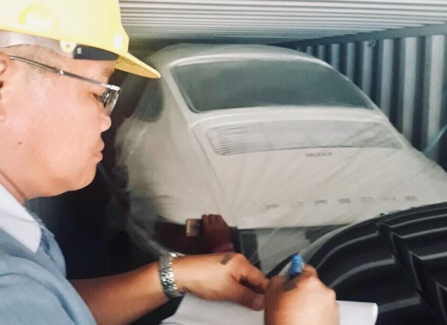 LOOK: Cebu port officials discover luxury vehicles in car part shipment