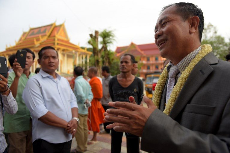 Cambodia king pardons jailed opposition lawmaker