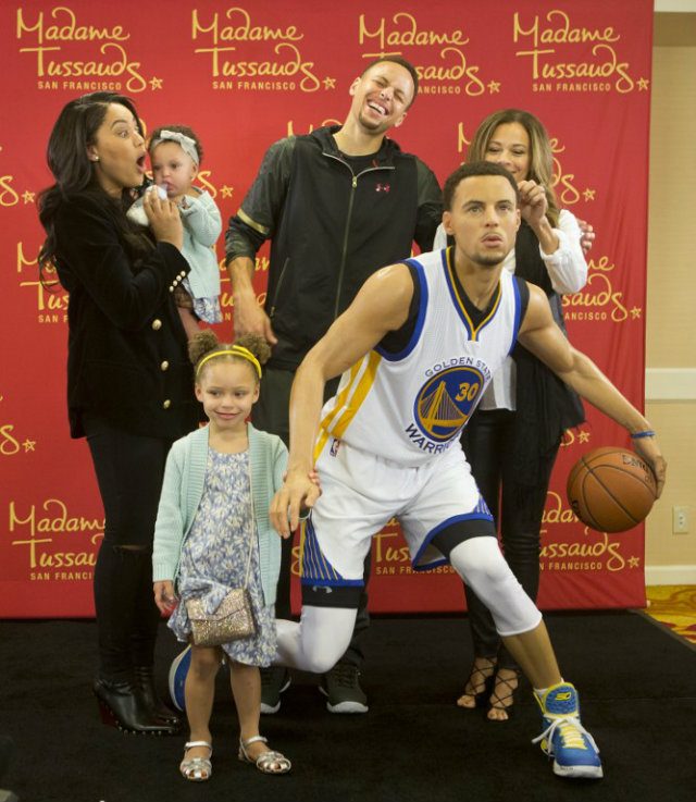 FAMILY PICTURE. The Curry's gather around Stephen Curry's wax figure at Madame Tussauds. Photo by Beck Diefenbach/Getty Images/AFP 