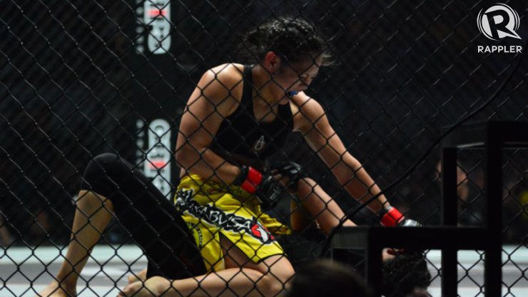Ana Julaton rains down punches on Aya Saber in full mount position. Photo by Nevin Reyes/Rappler