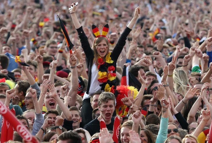 Fans in Hamburg, Germany celebrate the 3-0 goal on a live broadcast. Photo by Axel Heimken