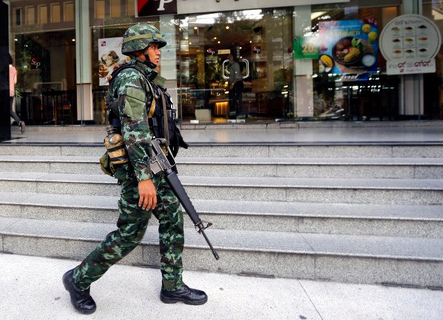 Thai army invokes martial law, urges rivals to talk