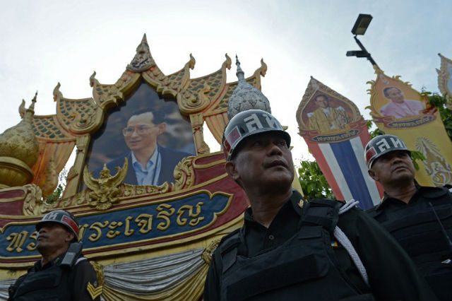 Elderly Thai man faces charges ‘for giving protesters flowers’