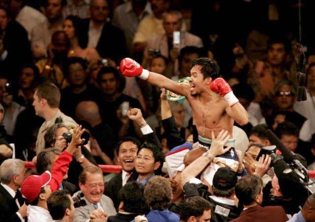 Manny Pacquiao's record of world title wins in 8 divisions is a record which will likely never be broken. Photo by Louie Traub/EPA   