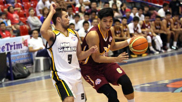 Don Trollano protects the ball against his defender. Photo by Nuki Sabio/PBA Images
