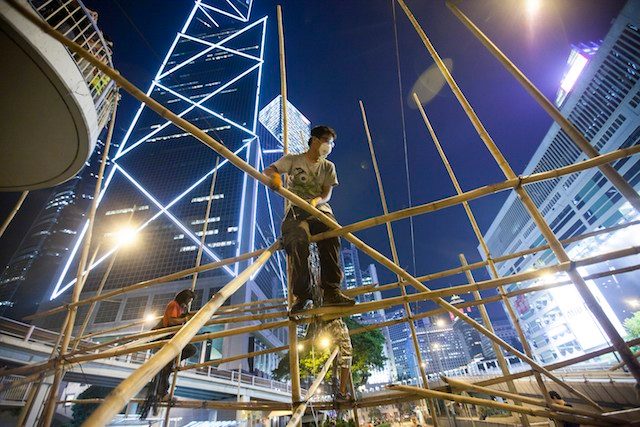 Pro-democracy protesters build a massive bamboo scaffolding barricade after the Hong Kong police vowed to remove any further barricades that were set up within the Occupy Central movement in the Central District of Hong Kong, China, 13 October 2014. Alex Hofford/EPA
