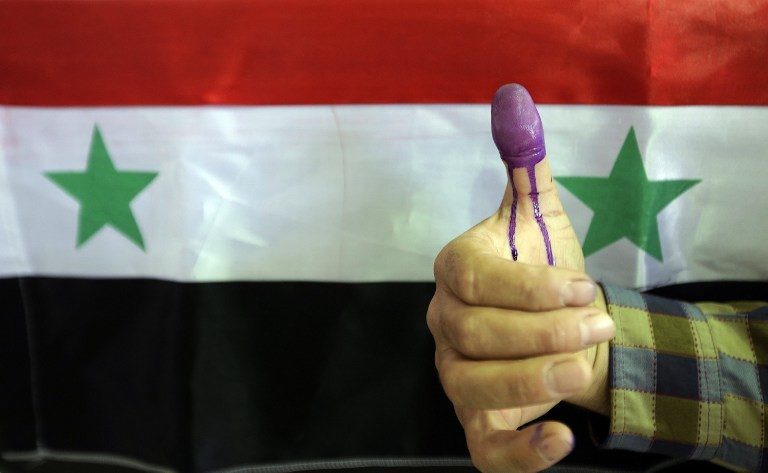 Syria regime stages controversial wartime president vote