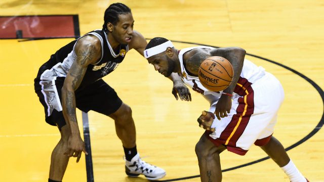 Kawhi Leonard (L) did as good a job as anyone could containing the league's best player during the NBA Finals. Photo by Larry W. Smith/EPA