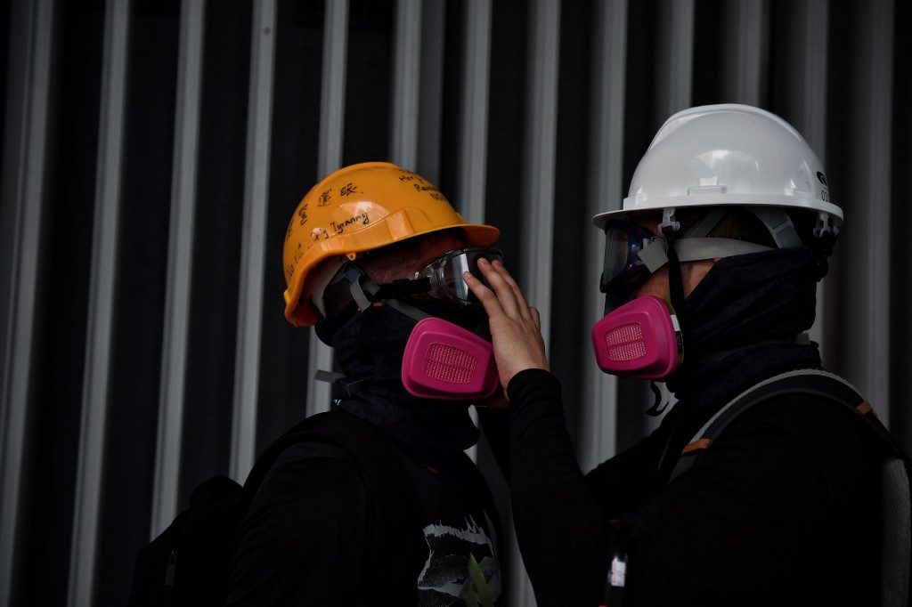 Shot HK protester charged by police, as gov’t moves to ‘ban face masks’