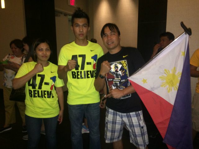 Jhonele (C) and his friends show their support for Manny Pacquiao at the Delano Hotel. Photo by Ryan Songalia 