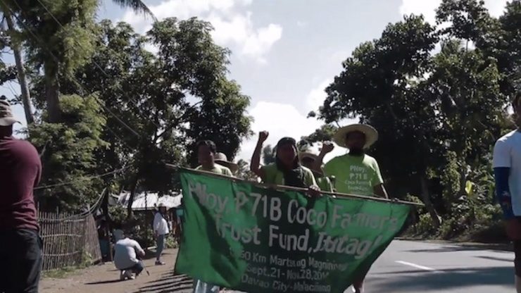 Marching coconut farmers seek audience with Aquino