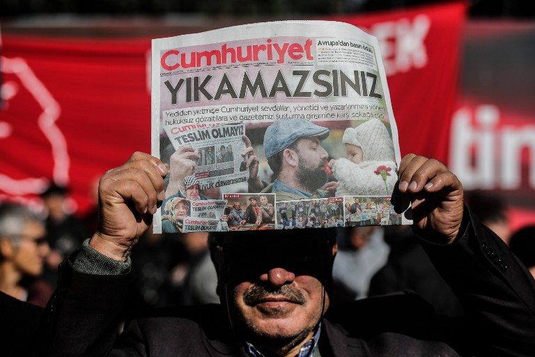 Turkish court jails 9 staff of opposition daily
