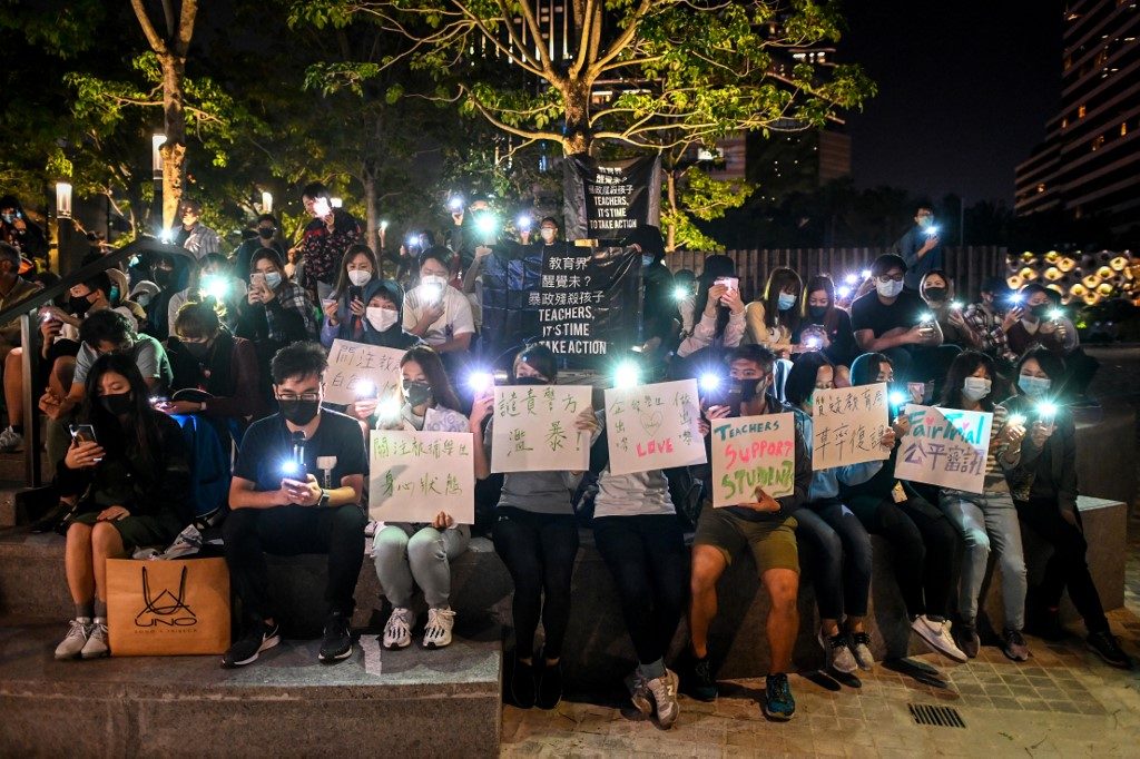 Hong Kong university protesters defy surrender warnings
