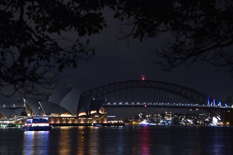 World cities go dark as Earth Hour climate campaign circles globe