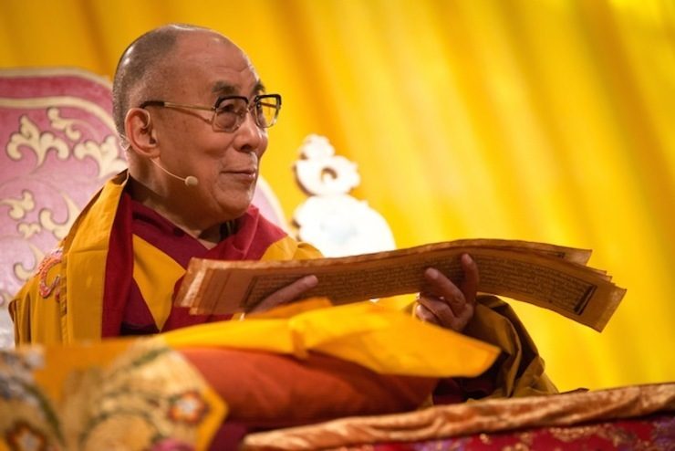 Dalai Lama, spiritual leader of the Tibetan, reads at a ceremony in Hamburg, Germany, 26 August 2014. File photo by Christian Charisius/EPA