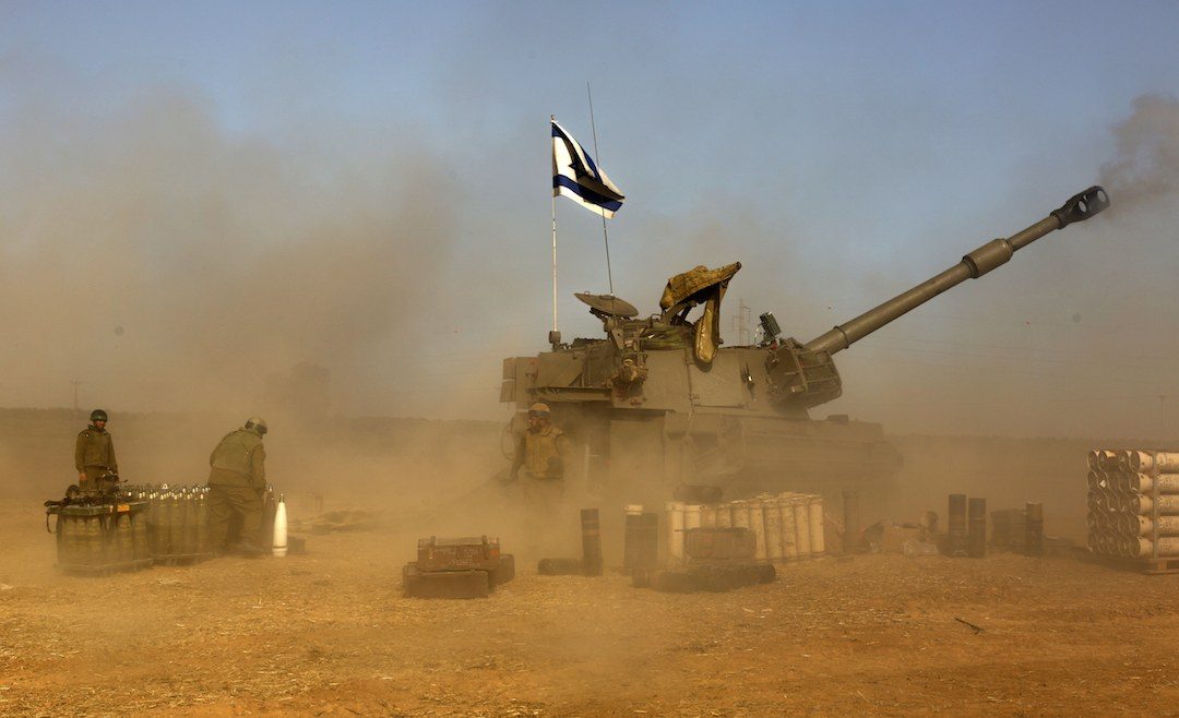 OPERATION. Israeli artillery positioned at the Israeli border with Gaza, shell toward targets in the Gaza Strip, 12 July 2014. Israel moved three infantry brigades closer to the coastal enclave in preparation for a possible ground offensive. Photo by Atef Safadi / AFP