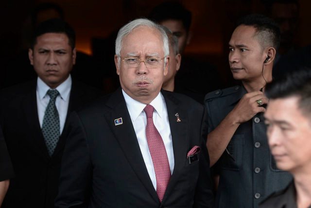 Outrage and new questions after Malaysia PM cleared in scandal