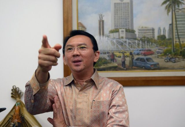Jakarta governor accused of blasphemy faces police