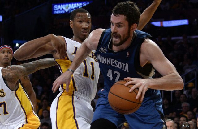 Minnesota Timberwolves power forward Kevin Love (R) would make a solid 1-2 combination with Celtics PG Rajon Rondo. Photo by Michael Nelson/EPA