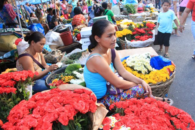 SELLING FLOWERS. Mary Chris Ardiente, 25, has been selling flowers since she was in fourth grade. Image courtesy Apple Grace Danuco  