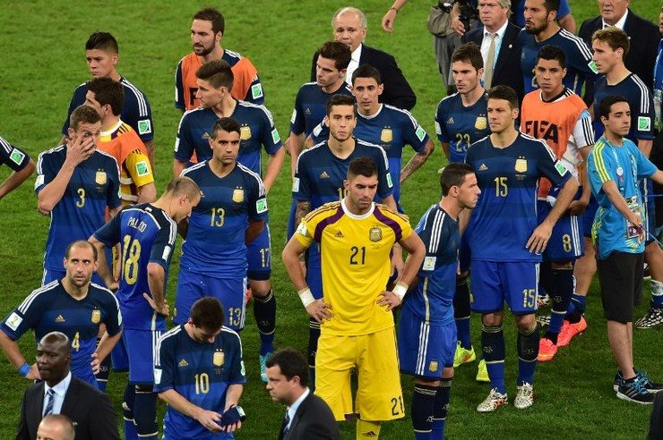 Argentina's players are stunned after losing to Germany in the 2014 World Cup final, 0-1. Photo by Nelson Almeida/AFP