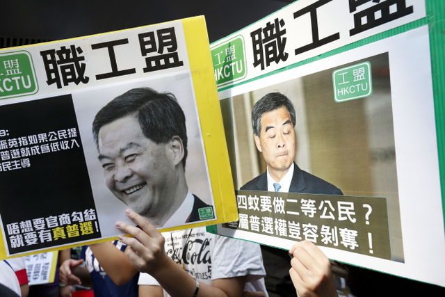 Hong Kong lawmakers call for inquiry into city leader