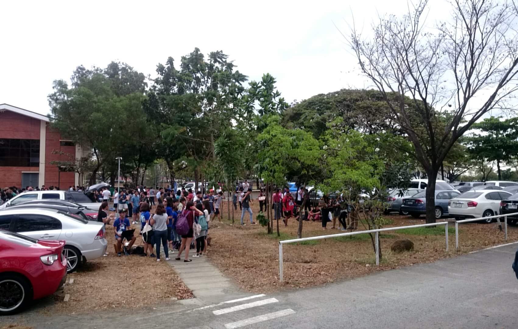 EMERGENCY. Students, faculty, and staff assembling outdoors during an evacuation at the Ateneo de Manila University campus, March 28, 2016. Photo courtesy of Jose Adrian Dalangin  