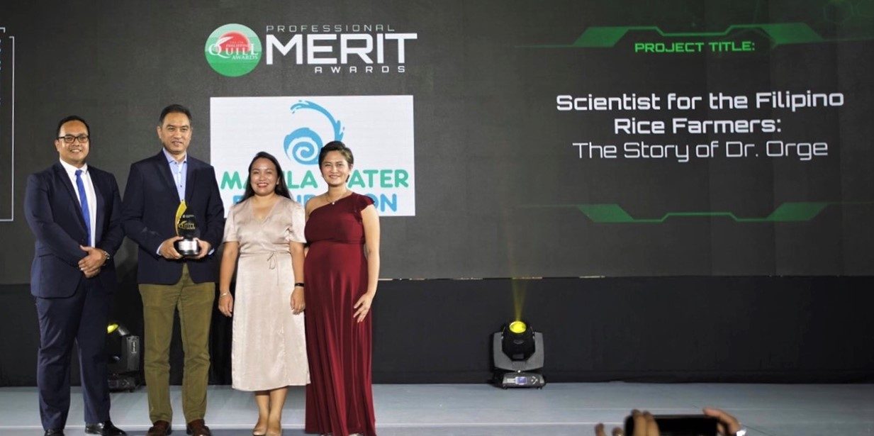 AWARD OF MERIT. (L-R) Manila Water Foundation Executive Director Reginald Andal, Former President Ferdinand dela Cruz, Special Programs Manager Coelli Masajo-Hernandez, and Communications Manager Jill Iris Ramos received the Award of Merit for the entry "Scientist for the Filipino Rice Farmers: The Story of Dr. Orge". 