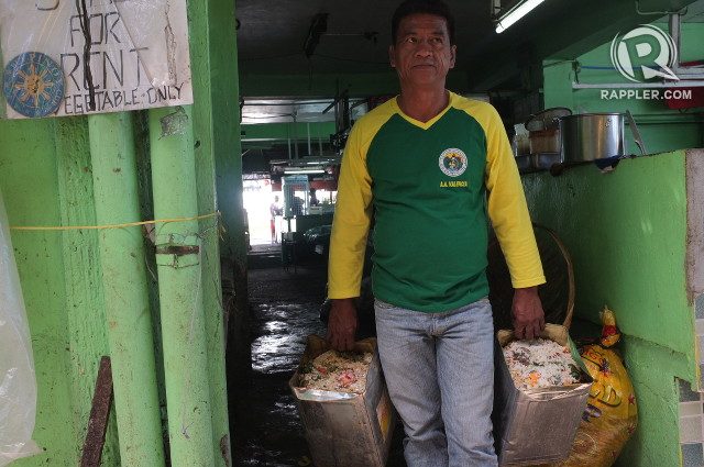 READY FOR COLLECTION. Food waste truck assistant Alex Valencia collects the food waste readied by a small eatery 