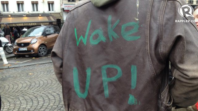 WAKE UP. An advocate sports a leather jacket asking people to 'wake up' to the realities of climate change. 