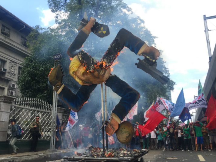 ‘Not welcome in PH’: Filipino activists set fire to Trump effigy
