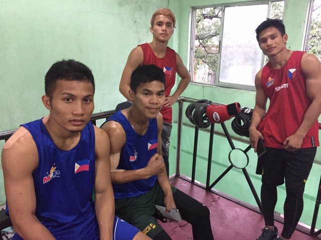 NATIONAL TEAM. Mario Fernandez (L) with national team members (from left) Carlo Paalam, Dannel Maamo and Ian Clark Bautista. Paalam and Bautista will also fight at the SEA Games while Maamo will fight at the World Championships in Germany. Photo by Ryan Songalia/Rappler  