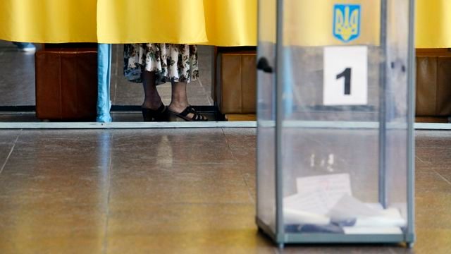Divided Ukraine holds vote shunned by rebel-held east