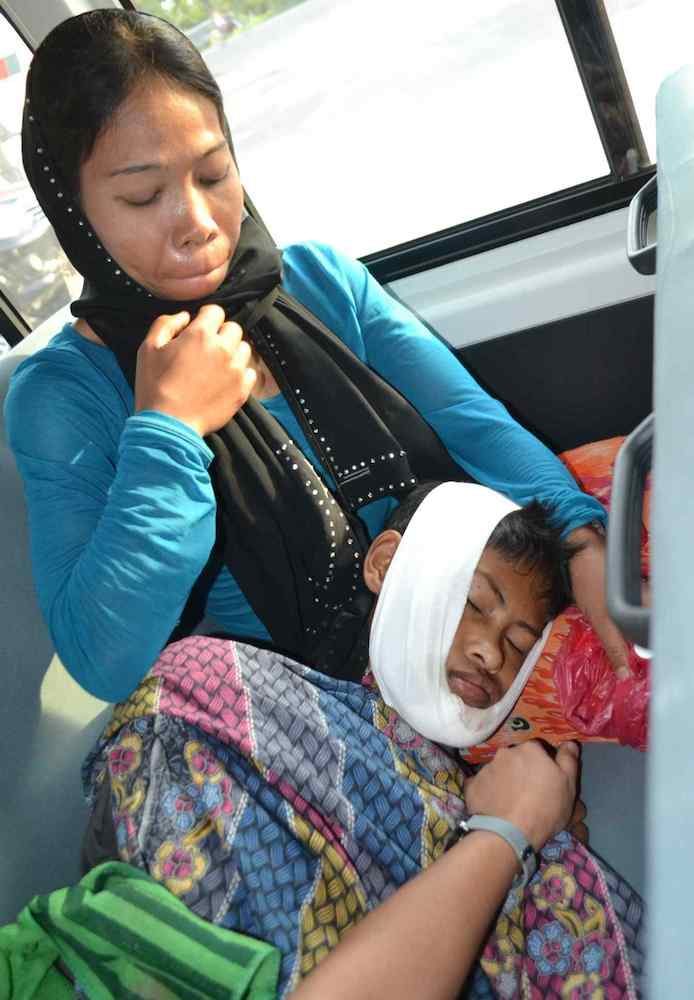 COLLATERAL DAMAGE. A woman looks after a boy who just received treatment for injuries he sustained during clashes between state troops and the BIFF. Photo by ARMM Heart