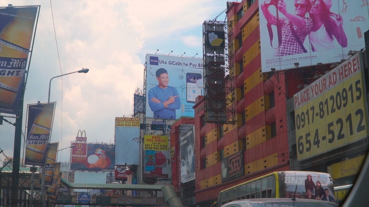 CROWDED. Billboards dominate EDSA. Photo by Naoki Mengua/Rappler 