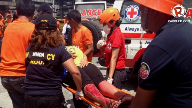 SIMULATION. The drill also simulates emergency situations. In this scenario, an injured pregnant woman receives medical assistance from the MMDA response team 