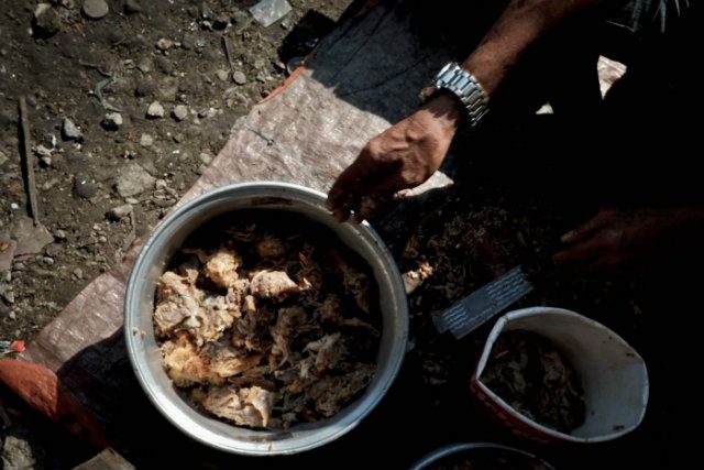 MAIN INGREDIENT. Instead of the traditional chevon or beef, Norberto uses chicken flakes for his budget kaldereta meal. 