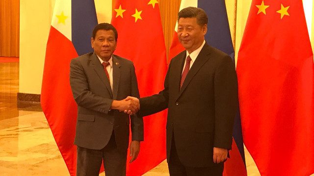 SLEEPING OVER PH RIGHTS? Philippine President Rodrigo Duterte and Chinese President Xi Jinping shake hands before their bilateral meeting at the Great Hall of the People, Beijing. MPC pool photo 