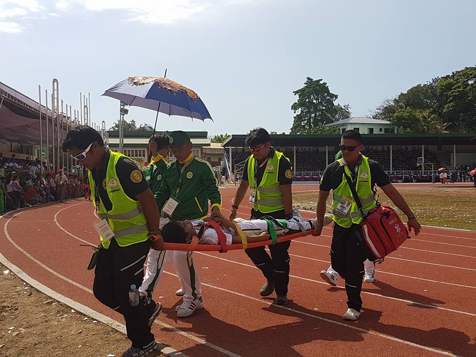 PALARO HEAT. Medics carry a delegate from Eastern Visayas after he passed out due to the scorching heat during the Palarong Pambansa 2017 opening at the Binirayan Stadium, Antique. Photo by Mark Rich Pablo/ Palaro Mover,NCR   