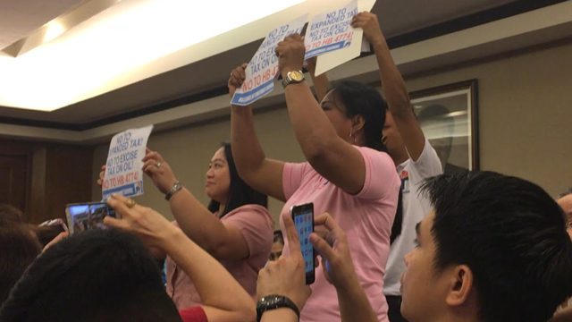 Teachers disrupt House hearing, protest DOF tax proposal