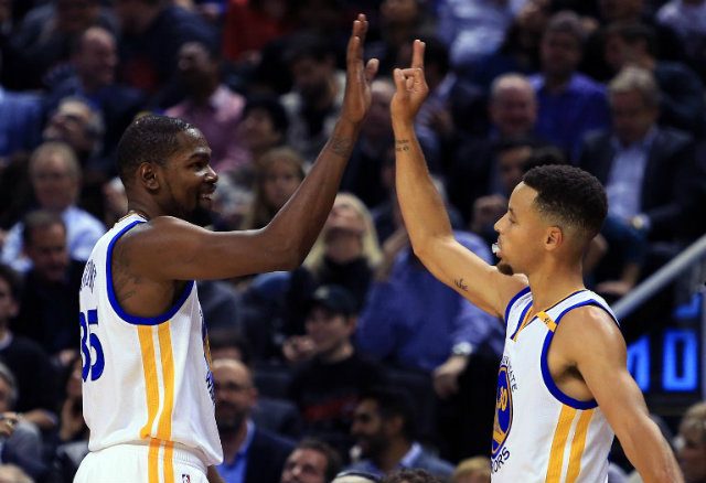 Curry outguns Davis as Warriors dig deep to overcome Pelicans