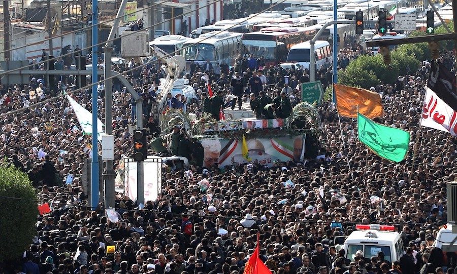 MOURNING. A large crowd surrounds the coffins of slain top commander Qasem Soleimani and Iraqi paramilitary chief Abu Mahdi al-Muhandis, as they are transported atop a vehicle after their arrival at Ahvaz International Airport in southwestern Iran on January 5, 2020. Photo by Fatemeh Rahimavian/Fars news/AFP 