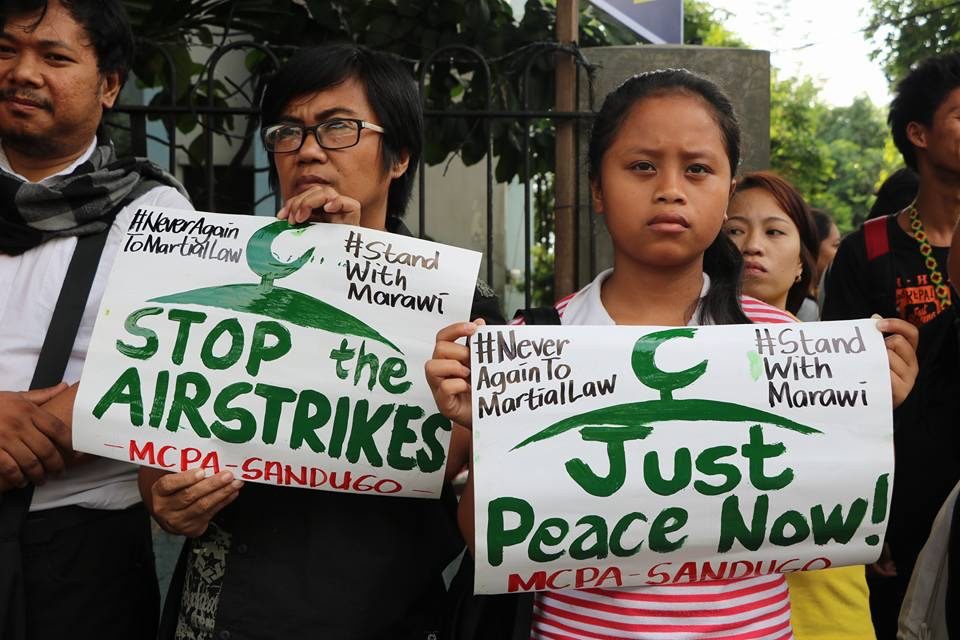 STOP THE AIRSTRIKES. Members of the 
Sandugo - Movement of Moro and Indigenous Peoples for Self-Determination call on President Rodrigo Duterte to lift his martial law declaration in Mindanao. Photo courtesy of Sandugo 