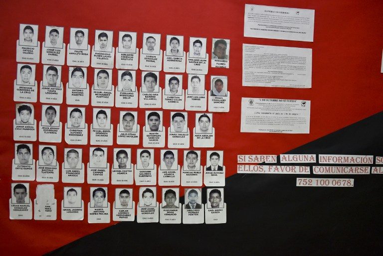 THE MISSING. A placard with the portraits of the 43 missing students of the Raul Isidro Burgos teachers's school is seen at the dining room of their school in Ayotzinapa, Guerrero state, Mexico on October 26, 2014. Yuri Cortez/AFP