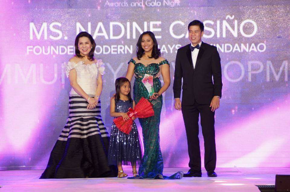 WOMAN OF SIGNIFICANCE. Nadine Casino receives her award with daughter and Tourism Secretary Wanda Teo. Photo from Nadine Casiño 