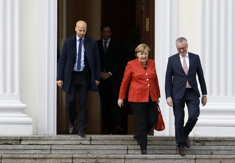 Germany’s Merkel battles to stay in power despite crisis